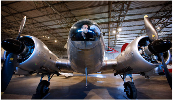 Conservator Thilo Burgel cleans up the nose cone of an Avro Anson aircraft at the newly redeveloped civil aviation hangar at the National Museum of Flight, East Fortune Airfield  © Paul Dodds.
