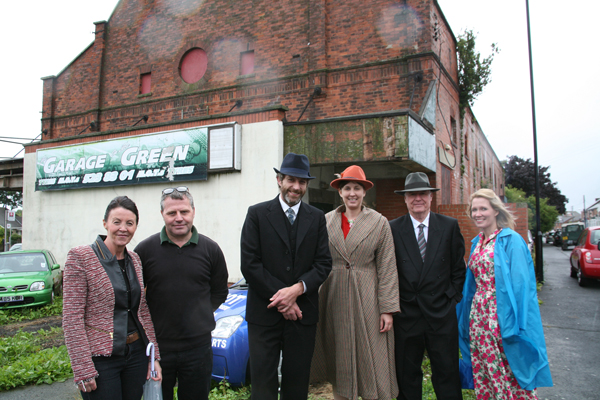 Exterior of the former cinema at Ryhope, Sunderland with Beamish staff and former owners.  The cinema will be removed and redisplayed at Beamish.