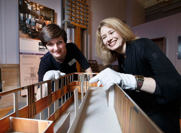 Curators Joanna Norman (V&A) and Alison Brown (Glasgow Museums) with a scale model of the Oak Room.  The huge former tearoom will become part of V&A Dundee when it opens in 2018.