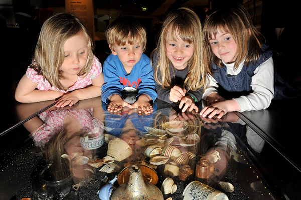  Children look at objects in the underfloor cases in the Expanding City gallery at the Museum of London.  Courtesy of the Museum, one of the images from Museums Matter.