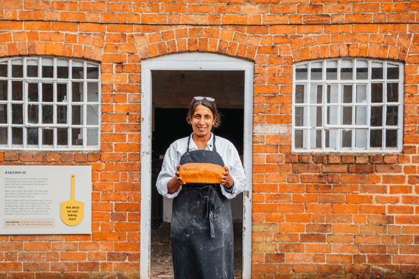 baker outside red brick bake house