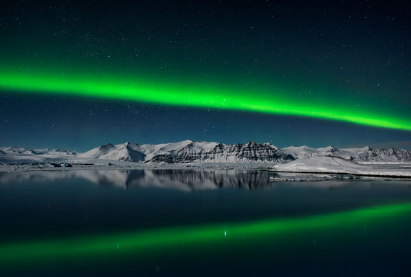 Northern Lights over Jokulsarlon, Iceland © Giles Rocholl (UK) Northern Lights streaking across the night sky over the lagoon at Jokulsarlon, Iceland on Valentine’s night of 2016 