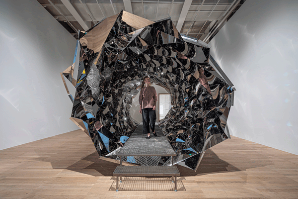 sculpture with mirrors in spiral shape for visitors to walk through