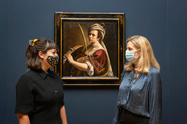 women in face masks look at artemesia self portrait