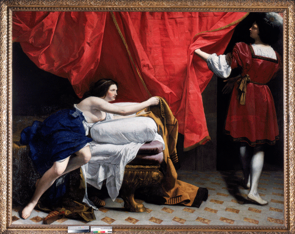 man holding curtain looks at woman on bed