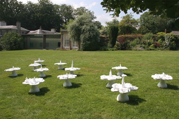 white shapes installed on green lawn