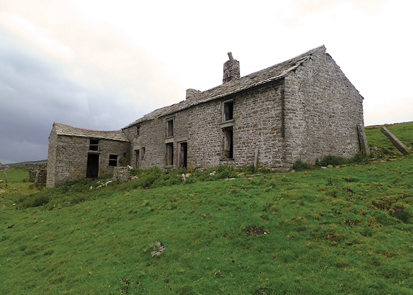 derelict farm building in fields