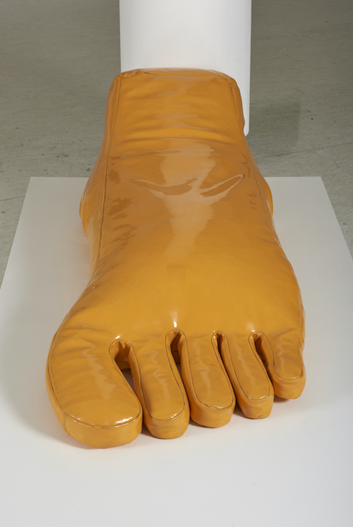 sofa shaped like giant yellow foot