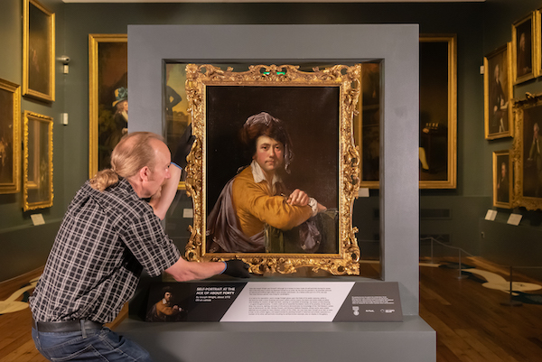 man handling joseph wright portrait