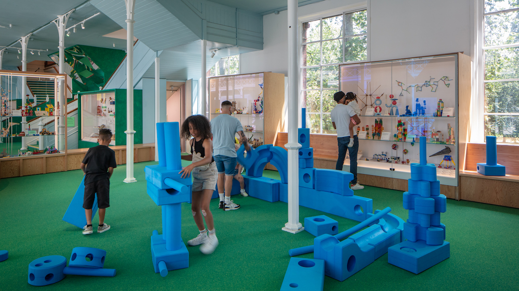 Play Gallery children are building with large blue foam blocks