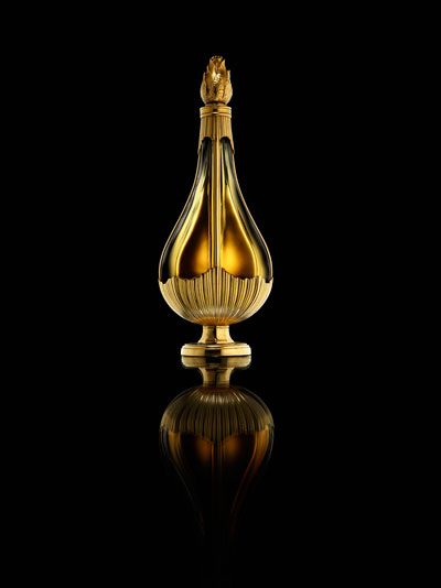 teardrop shaped gold perfume bottle
